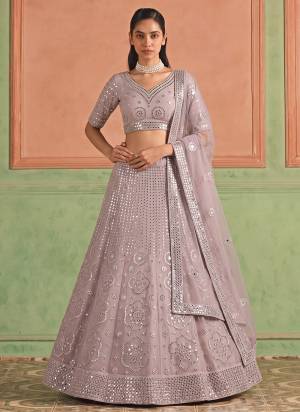 For A Designer Look,Grab These Lehenga Choli in Fine Colored.These Lehenga And Blouse Are Fabricated On Organza Pair With Soft Net Dupatta.Its Beautified With Designer Embroidery,Foil Mirror Work.