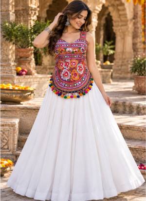 Looking These Navratri Wear Lehenga Choli in Fine Colored.These Lehenga Are Georgette Choli Are Cotton Fabricated On Crepe Inner Pair.Its Beautified With Designer Kutchi Mirror Embroidery Work.