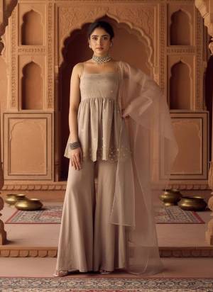 Looking These Suit in Fine Colored Pair With Bottom And Dupatta.These Top Are Viscose Organza And Bottom Are Fabricated On Chanderi Pair With Organza Dupatta.Its Beautified With Designer Beads Embroidery Work.