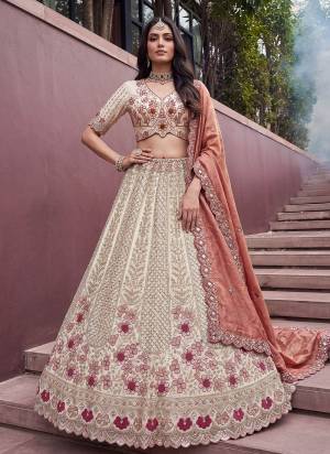 For A Fancy Designer Look,Grab These Lehenga Choli With Dupatta in Fine Colored.These Lehenga And Choli Are Silk And Dupatta Are Fabricated On Soft Banarasi Pair.Its Beautified With Motif Beads,Sequance,Thread Embroidery Work. 