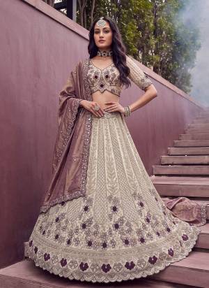 For A Fancy Designer Look,Grab These Lehenga Choli With Dupatta in Fine Colored.These Lehenga And Choli Are Silk And Dupatta Are Fabricated On Soft Banarasi Pair.Its Beautified With Motif Beads,Sequance,Thread Embroidery Work. 