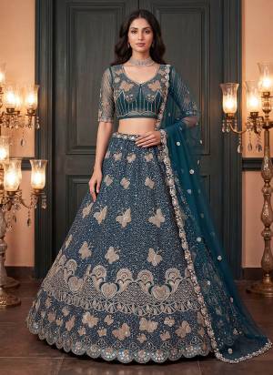 For A Fancy Designer Look,Grab These Lehenga Choli With Dupatta in Fine Colored.These Lehenga And Choli Are Net And Dupatta Are Fabricated On Soft Soft Pair.Its Beautified With Jari,Sequance,Multy Thread Embroidery,Crystel Hand Work. 