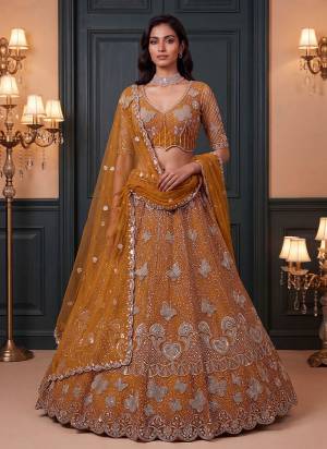 For A Fancy Designer Look,Grab These Lehenga Choli With Dupatta in Fine Colored.These Lehenga And Choli Are Net And Dupatta Are Fabricated On Soft Soft Pair.Its Beautified With Jari,Sequance,Multy Thread Embroidery,Crystel Hand Work. 