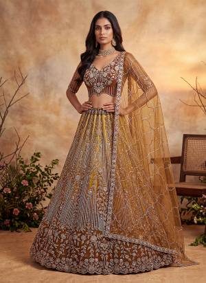 For A Fancy Designer Look,Grab These Lehenga Choli With Dupatta in Fine Colored.These Lehenga And Choli Are Net And Dupatta Are Fabricated On Soft Soft Pair.Its Beautified With Jari,Sequance,Multy Thread Embroidery,Crystel Hand Work. 