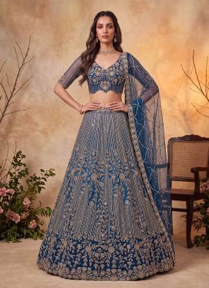 For A Fancy Designer Look,Grab These Lehenga Choli With Dupatta in Fine Colored.These Lehenga And Choli Are Net And Dupatta Are Fabricated On Soft Soft Pair.Its Beautified With Jari,Sequance,Multy Thread Embroidery,Crystel Hand Work. 