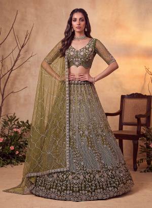 For A Fancy Designer Look,Grab These Lehenga Choli With Dupatta in Fine Colored.These Lehenga And Choli Are Net And Dupatta Are Fabricated On Soft Soft Pair.Its Beautified With Jari,Sequance,Multy Thread Embroidery,Crystel Hand Work. 