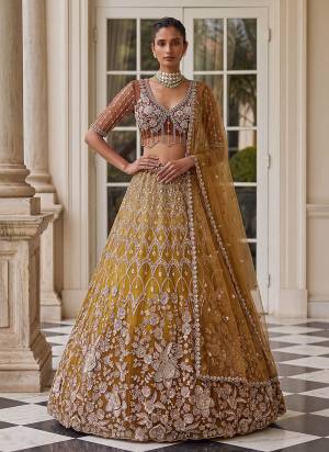 For A Fancy Designer Look,Grab These Lehenga Choli With Dupatta in Fine Colored.These Lehenga And Choli Are Net And Dupatta Are Fabricated On Soft Soft Pair.Its Beautified With Jari,Sequance,Multy Thread Embroidery,Crystel Hand Work. 