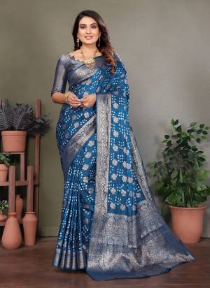 Attractive These Festive And Party Wear Saree in Fine Colored.These Saree And Blouse is Fabricated On Satin Silk.Its Beautified With Weaving Jari Rich Pallu Border And Butta Designer With Hand Made Bandhej Saree.