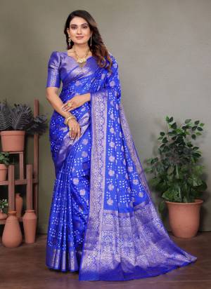 Attractive These Festive And Party Wear Saree in Fine Colored.These Saree And Blouse is Fabricated On Satin Silk.Its Beautified With Weaving Jari Rich Pallu Border And Butta Designer With Hand Made Bandhej Saree.