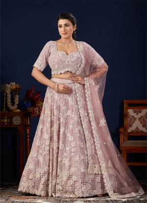 For A Designer Look,Grab These Lehenga Choli in Fine Colored.These Lehenga And Blouse Are Fabricated On Georgette Pair With Dupatta Are Net.Its Beautified With Heavy Designer Embroidery Work.