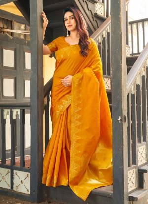 Garb These Festive And Party Wear Saree in Fine Colored.These Saree And Blouse is Fabricated On Banarasi Raw Silk.Its Beautified With Woven Golden Jari Temple Designer.
