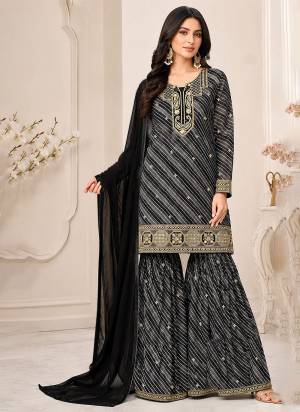 Looking These Party Wear Designer Sharara Suits in Fine Colored Pair With Dupatta.These Top Are Georgette And Dupatta Are Fabricated On Nazmin Pair With Georgette Bottom And Inner.Its Beautified With Designer Printed,Embroidery Work.