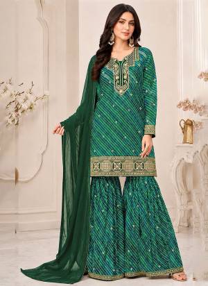Looking These Party Wear Designer Sharara Suits in Fine Colored Pair With Dupatta.These Top Are Georgette And Dupatta Are Fabricated On Nazmin Pair With Georgette Bottom And Inner.Its Beautified With Designer Printed,Embroidery Work.