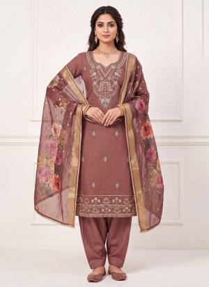 Grab These Suit in Fine Colored Pair With Bottom And Dupatta.These Top Are Cotton Silk And Dupatta Are Fabricated On Cotton Silk Pair With Dull Santoon Bottom.Its Beautified With Designer Digital Printed, Hand Work.