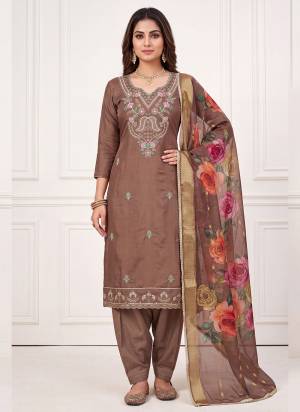 Grab These Suit in Fine Colored Pair With Bottom And Dupatta.These Top Are Cotton Silk And Dupatta Are Fabricated On Cotton Silk Pair With Dull Santoon Bottom.Its Beautified With Designer Digital Printed, Hand Work.