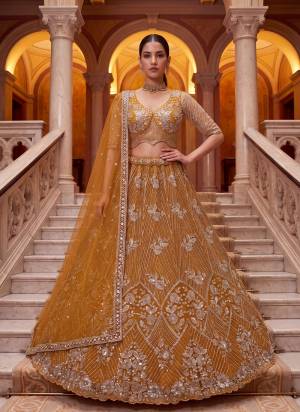 For A Fancy Designer Look,Grab These Lehenga Choli With Dupatta in Fine Colored.These Lehenga And Choli Are Net And Dupatta Are Fabricated On Net Pair.Its Beautified With Sequance,Thread Embroidery,Beads Work. 