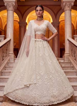 For A Fancy Designer Look,Grab These Lehenga Choli With Dupatta in Fine Colored.These Lehenga And Choli Are Net And Dupatta Are Fabricated On Net Pair.Its Beautified With Sequance,Thread Embroidery,Beads Work. 