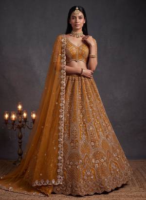 For A Fancy Designer Look,Grab These Lehenga Choli With Dupatta in Fine Colored.These Lehenga And Choli Are Net And Dupatta Are Fabricated On Net Pair.Its Beautified With Sequance,Thread Embroidery,Beads Work. 