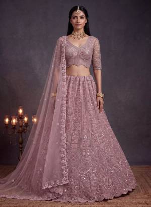 For A Fancy Designer Look,Grab These Lehenga Choli With Dupatta in Fine Colored.These Lehenga And Choli Are Net And Dupatta Are Fabricated On Net Pair.Its Beautified With Sequance,Thread Embroidery,Beads Work. 
