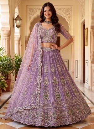 For A Fancy Designer Look,Grab These Lehenga Choli With Dupatta in Fine Colored.These Lehenga And Choli Are Net And Dupatta Are Fabricated On Soft Net Pair.Its Beautified With Patch,Jari,Multy Thread Embroidery,Crystal Hand Work. 