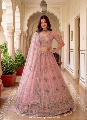 For A Fancy Designer Look,Grab These Lehenga Choli With Dupatta in Fine Colored.These Lehenga And Choli Are Net And Dupatta Are Fabricated On Soft Net Pair.Its Beautified With Patch,Jari,Multy Thread Embroidery,Crystal Hand Work. 