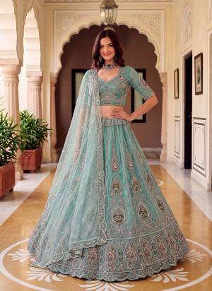 For A Fancy Designer Look,Grab These Lehenga Choli With Dupatta in Fine Colored.These Lehenga And Choli Are Net And Dupatta Are Fabricated On Soft Net Pair.Its Beautified With Patch,Jari,Multy Thread Embroidery,Crystal Hand Work. 