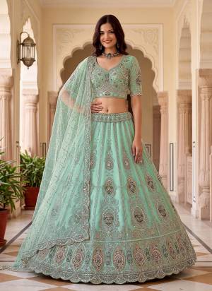 For A Fancy Designer Look,Grab These Lehenga Choli With Dupatta in Fine Colored.These Lehenga And Choli Are Net And Dupatta Are Fabricated On Soft Net Pair.Its Beautified With Patch,Jari,Multy Thread Embroidery,Crystal Hand Work. 