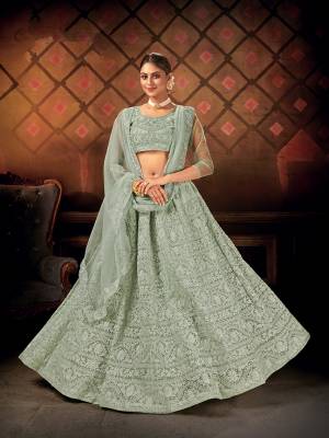 Heavy Designer Lehenga Choli In Fine Color Fabricated On Net Beautified With Heavy Attractive Embroidery Work & Net Dupatta.Wedding Bridal Collection. 