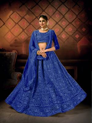 Heavy Designer Lehenga Choli In Fine Color Fabricated On Net Beautified With Heavy Attractive Embroidery Work & Net Dupatta.Wedding Bridal Collection. 