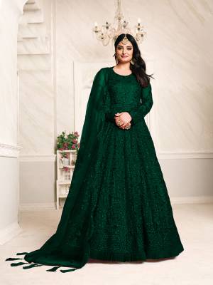 Get Ready For The Upcoming Wedding Season With This Heavy Designer Floor Length Suit In Dark Color. Its Heavy Embroidered Top Is Fabricated On Net Paired With Santoon Bottom And Net Fabricated Dupatta Which Has Pretty Elegant Embroidered. 