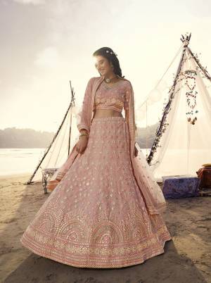 Heavy Designer Lehenga Choli In Light Base Color Fabricated On Organza Beautified With Heavy Attractive Embroidery With Mirror And Soft Net Dupatta. 