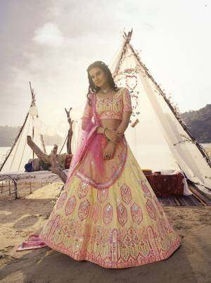 Heavy Designer Lehenga Choli In Light Base Color Fabricated On Organza Beautified With Heavy Attractive Embroidery With Mirror And Soft Net Dupatta. 