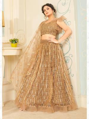 Heavy Designer Lehenga Choli And Dupatta In Light Color Fabricated On Soft Net Beautified With Heavy Attractive Sequance Thread Dori Embroidery. 