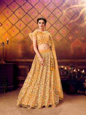 Here Is A Very Pretty Heavy Designer Lehenga Choli For The Bridesmaid In This Lovely Color. This Detailed Embroidered Lehenga Choli And Dupatta Are Fabricated On Soft Net Which Is Light Weight, Durable And Gives A Pretty Look The Personality. Buy This Pretty Piece Now. 

