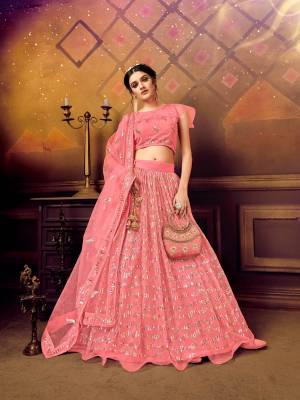 Here Is A Very Pretty Heavy Designer Lehenga Choli For The Bridesmaid In This Lovely Color. This Detailed Embroidered Lehenga Choli And Dupatta Are Fabricated On Soft Net Which Is Light Weight, Durable And Gives A Pretty Look The Personality. Buy This Pretty Piece Now. 

