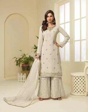 Attract All Wearing This Designer Suit In Fine Color. Its Pretty Top Is Fabricated On Georgette Paired With Georgette Fabricated Bottom and Net Dupatta. This Suit's Top, Bottom And Dupatta Are Beautified With Detailed Heavy Embroidery. Buy This Pretty Piece Now.