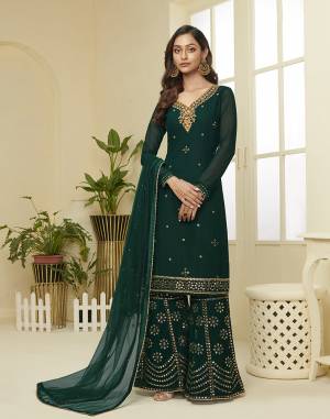 Attract All Wearing This Designer Suit In Fine Color. Its Pretty Top Is Fabricated On Georgette Paired With Georgette Fabricated Bottom and Net Dupatta. This Suit's Top, Bottom And Dupatta Are Beautified With Detailed Heavy Embroidery. Buy This Pretty Piece Now.