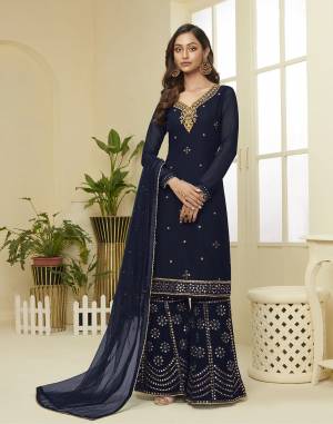 Attract All Wearing This Designer Suit In Fine Color. Its Pretty Top Is Fabricated On Georgette Paired With Georgette Fabricated Bottom and Net Dupatta. This Suit's Top, Bottom And Dupatta Are Beautified With Detailed Heavy Embroidery. Buy This Pretty Piece Now.