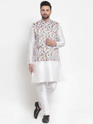 Here Is A Rich And Decent Looking Readymade Pair Of Men's Kurta Pyjama With Jacket. This Kurta And Pyjama Are Fabricated On Raw Silk Paired With Satin Printed Fabricated Jacket. Buy This Pair For The Upcoming Wedding And Festive Season. 

