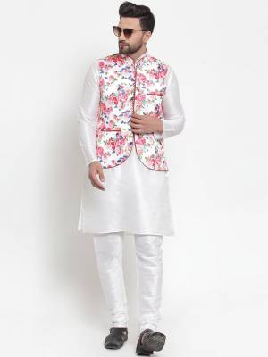 Here Is A Rich And Decent Looking Readymade Pair Of Men's Kurta Pyjama With Jacket. This Kurta And Pyjama Are Fabricated On Raw Silk Paired With Satin Printed Fabricated Jacket. Buy This Pair For The Upcoming Wedding And Festive Season. 

