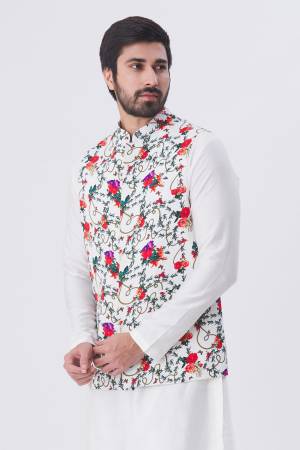 Here Is A Rich And Decent Looking Readymade Pair Of Men's Kurta Pyjama With Jacket. This Kurta And Pyjama Are Fabricated On Raw Silk Paired With Satin Printed Fabricated Jacket. Buy This Pair For The Upcoming Wedding And Festive Season. 

