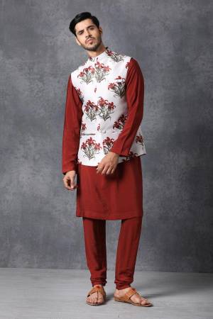 Here Is A Rich And Decent Looking Readymade Pair Of Men's Kurta Pyjama With Jacket. This Kurta And Pyjama Are Fabricated On Raw Silk Paired With Satin Printed Fabricated Jacket. Buy This Pair For The Upcoming Wedding And Festive Season. 

