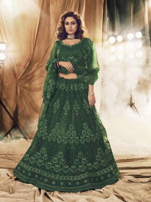 This Wedding Season Heavy Designer Lehenga Choli In Green Color Fabricated On Net Beautified With Heavy Attractive Cording Embroidery With Dupatta. 