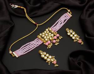 Give An Enhanced Look To Your Personality By Pairing Up This Beautiful Necklace Set With Your Ethnic Attire. This Pretty Set Is In Color Beautified With Pearl And Stone Work. Buy Now.