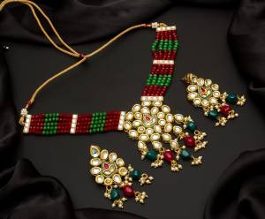 Give An Enhanced Look To Your Personality By Pairing Up This Beautiful Necklace Set With Your Ethnic Attire. This Pretty Set Is In Color Beautified With Pearl And Stone Work. Buy Now.