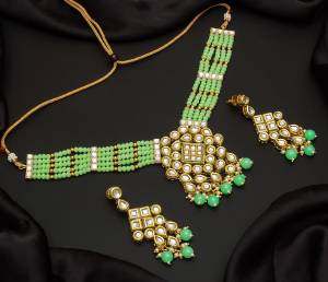 Give An Enhanced Look To Your Personality By Pairing Up This Beautiful Necklace Set With Your Ethnic Attire. This Pretty Set Is In Color Beautified With Pearl And Stone Work. Buy Now.