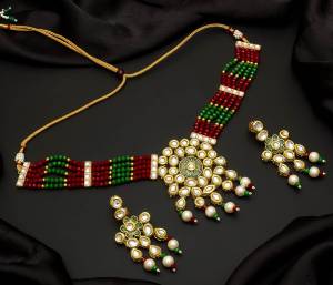 Give An Enhanced Look To Your Personality By Pairing Up This Beautiful Necklace Set With Your Ethnic Attire. This Pretty Set Is In Color Beautified With Pearl And Stone Work. Buy Now.