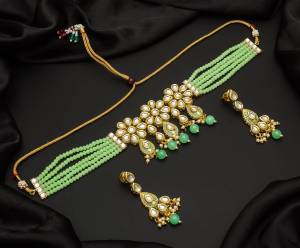 Give An Enhanced Look To Your Personality By Pairing Up This Beautiful Necklace Set With Your Ethnic Attire. This Pretty Set Is In Color Beautified With Pearl And Stone Work. Buy Now.