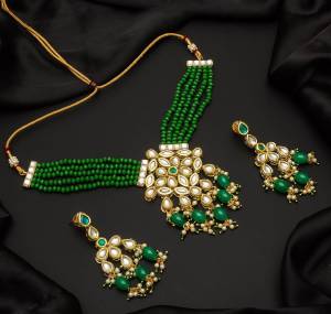 Give An Enhanced Look To Your Personality By Pairing Up This Beautiful Necklace Set With Your Ethnic Attire. This Pretty Set Is In Color Beautified With Pearl And Stone Work. Buy Now.