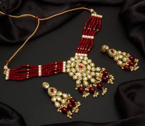 Give An Enhanced Look To Your Personality By Pairing Up This Beautiful Necklace Set With Your Ethnic Attire. This Pretty Set Is In Color Beautified With Pearl And Stone Work. Buy Now.